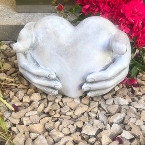 Heart in hands sculpture grave decoration grave heart grave decoration
