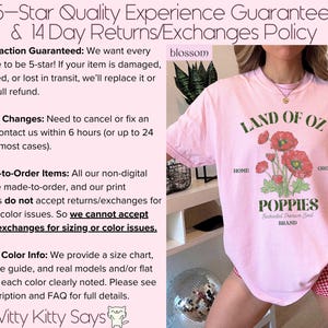 May include: A light pink t-shirt with the text "LAND OF OZ POPPIES" and a graphic of red poppies. The shirt also has the text "HOME" and "GROWN". The shirt is part of the "blossom" brand.