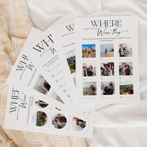 A deck of 5 different "Where were they" photo game cards laying on soft, white fabric