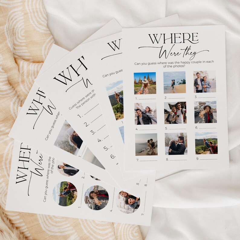 A deck of 5 different "Where were they" photo game cards laying on soft, white fabric