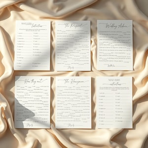 Bridal Mad libs games and instructions laying on soft, neutral fabric