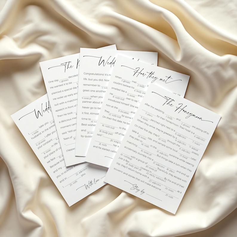 5 funny mad libs games to print at home, laying on soft, neutral fabric