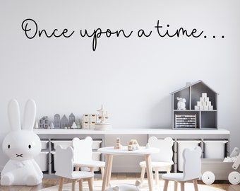 May include: A white playroom with a white rabbit toy, a white table and four white chairs with wooden legs, a gray toy shelf with a dollhouse and blocks, and a white wall with the text "Once upon a time..." written in black.