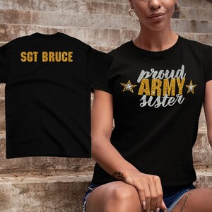 May include: Two black t-shirts. One says "Proud Army Sister" in gold glitter with silver stars. The other says "Sgt Bruce" in gold glitter.