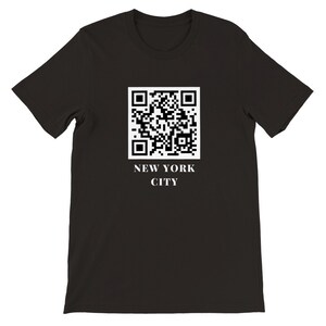 May include: Black t-shirt with a white QR code and the text "NEW YORK CITY" printed on the front.