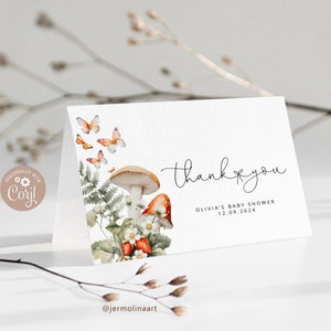 May include: Thank you card with a watercolor illustration of mushrooms, strawberries, and butterflies. The text reads "Thank you" and "Olivia's Baby Shower 12.09.2024".