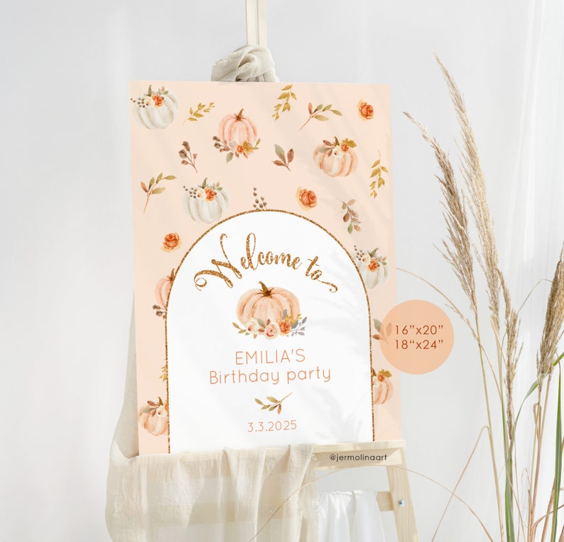 May include: A welcome sign for a birthday party with a peach background and a gold glitter arch. The sign features a pumpkin with flowers and leaves, and the text "Welcome to Emilia's Birthday Party 3.3.2025". The sign is available in two sizes: 16"x20" and 18"x24".