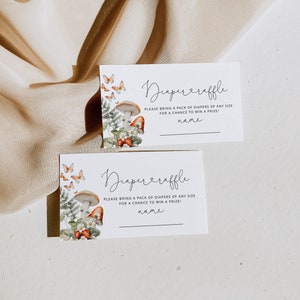 May include: Two white cards with a mushroom and butterfly design. The text on the cards reads "Diaper Raffle" and asks guests to bring a pack of diapers for a chance to win a prize.