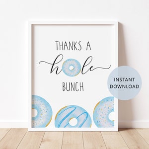 May include: A printable sign with the text "Thanks a hole bunch" and three blue donuts with white frosting and sprinkles. The sign is in a white frame and has the text "Instant Download" in a circle.