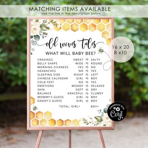 May include: A printable baby shower game with a honeycomb background and floral accents. The game is titled "Old Wives Tales" and asks guests to guess the gender of the baby based on a list of old wives' tales. The game is available in two sizes: 16 x 20 inches and 8 x 10 inches.