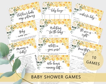 May include: A set of ten baby shower games with a honeybee and floral theme. The games include "Baby Name Race", "Mommy or Daddy", "What's in Your Purse", "Who Knows Mommy Best", "Baby Bingo", "Predictions for the Baby", "Wishes for Baby", "The Price is Right", "Name That Song Baby", and "Children's Books Image Pictionary".