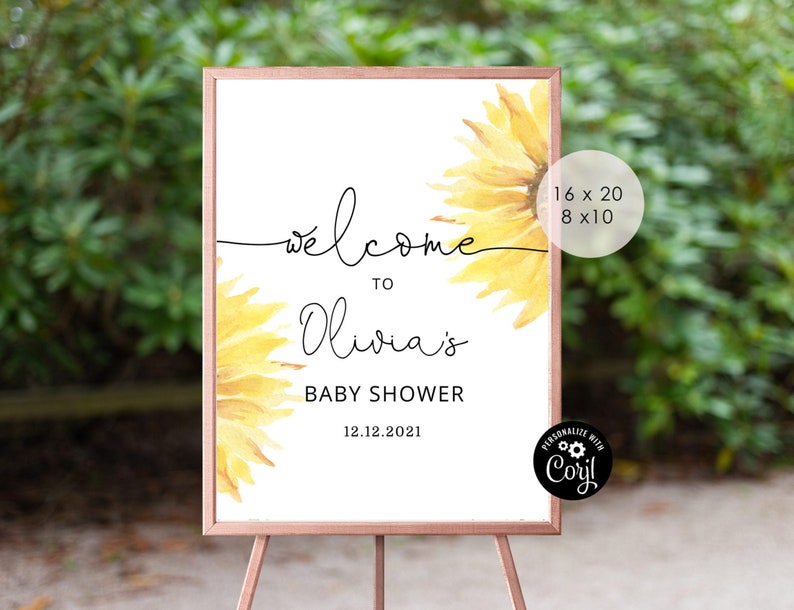 May include: Welcome to Olivia's Baby Shower sign with a sunflower design. The sign is printed on white cardstock and has a black frame. The sign is 16 x 20 inches or 8 x 10 inches.