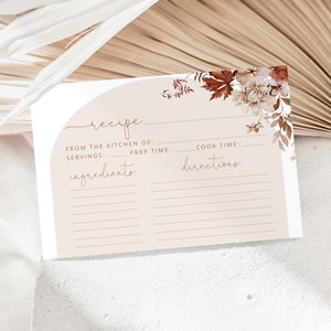 May include: A printable recipe card with a light brown background and a floral design in shades of brown and white. The card has sections for "From the Kitchen of", "Servings", "Prep Time", "Cook Time", "Ingredients", and "Directions".