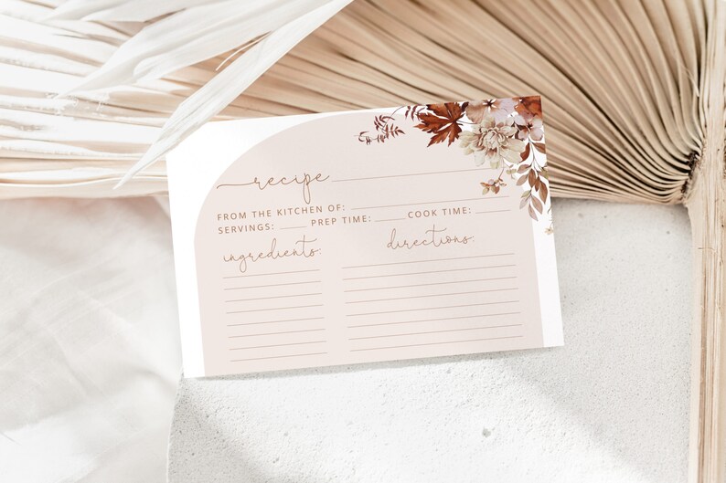 May include: A printable recipe card with a light brown background and a floral design in shades of brown and white. The card has sections for "From the Kitchen of", "Servings", "Prep Time", "Cook Time", "Ingredients", and "Directions".