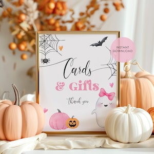 May include: Printable sign with a pink and white ghost, a pumpkin, and a spider web. The sign says "Cards & Gifts, thank you".