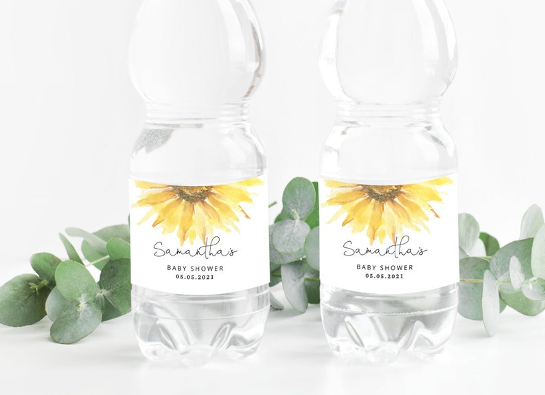 May include: Two clear plastic water bottles with labels featuring a watercolor sunflower design. The labels have the text "Samantha's Baby Shower 05.05.2021".