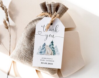 May include: White thank you tag with a watercolor illustration of a polar bear in a snowy forest. The tag says "Thank you" with a heart and "Jennifer's Baby Shower 05.05.2021".