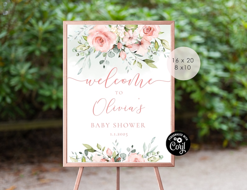 May include: A welcome sign for a baby shower with a floral design featuring pink roses and green leaves. The sign says "Welcome to Olivia's Baby Shower 1.1.2025".