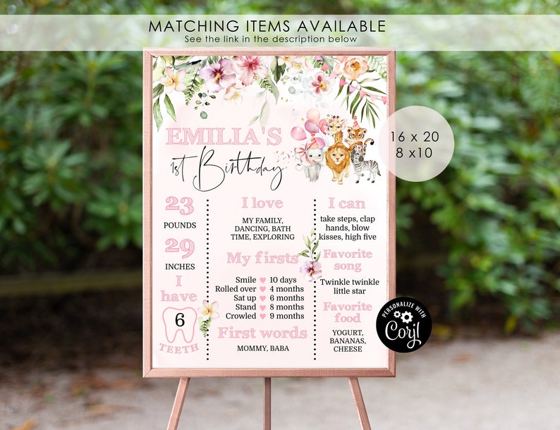 Op de afbeelding: Een roze en groene bloemen eerste verjaardagsbord met een jungledieren thema. Het bord bevat de naam "Emilia's 1st Birthday" en details over de groei van de baby, inclusief gewicht, lengte, eerste keer en favoriete dingen. Het bord is verkrijgbaar in twee maten: 16x20 en 8x10 inch.