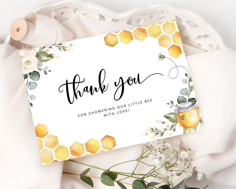 May include: Thank you card with a watercolor illustration of a honey jar, bee, and honeycomb. The card has the text "Thank you" and "For showering our little bee with love!"