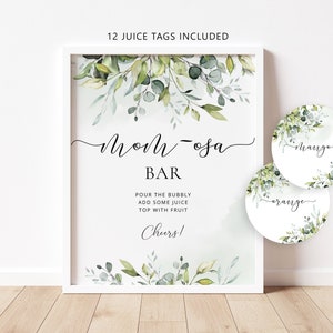 May include: A printable sign for a mimosa bar with greenery and the text "Mom-osa Bar" and instructions for making mimosas. It includes 12 printable juice tags with the text "orange" and "chrange".