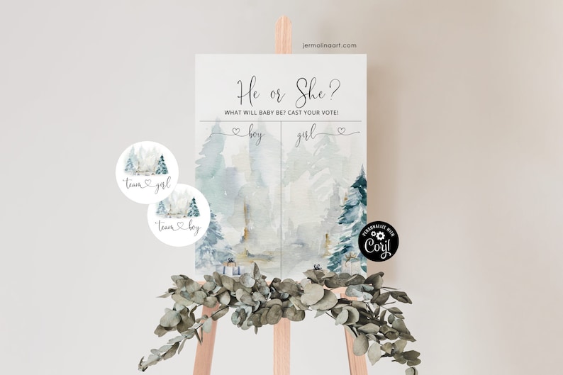 May include: A gender reveal party sign with a watercolor background of a winter forest scene. The sign says "He or She? What will baby be? Cast your vote!" with a heart and the words "boy" and "girl" on either side. There are two round stickers with a winter forest scene and the words "Team Girl" and "Team Boy".