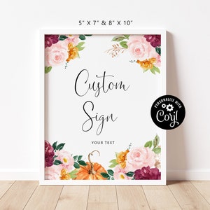 May include: A white framed sign with a floral design in shades of pink, burgundy, orange, and green. The sign says "Custom Sign" and "Your Text".