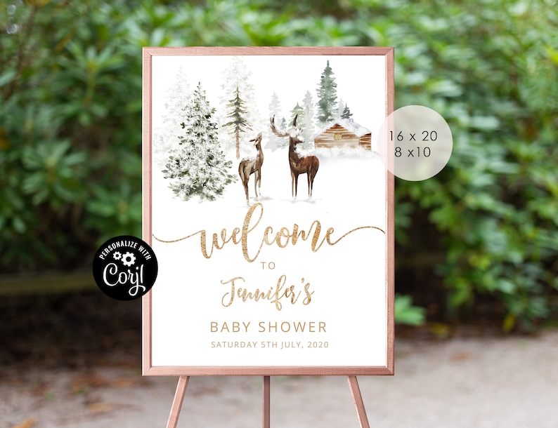 May include: Welcome sign for a baby shower with a winter woodland theme. The sign features a gold glitter font, a watercolor illustration of a snowy forest with two deer, and a small cabin. The text on the sign reads "Welcome to Jennifer's Baby Shower Saturday 5th July, 2020".