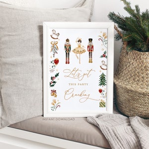 May include: White printable sign with a gold border and a watercolor illustration of a Nutcracker and a ballerina. The text on the sign reads "Let's get this party cracking".