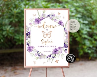 May include: Purple and gold floral welcome sign with a butterfly and the text "Welcome to Sophia's Baby Shower 03.03.2023".