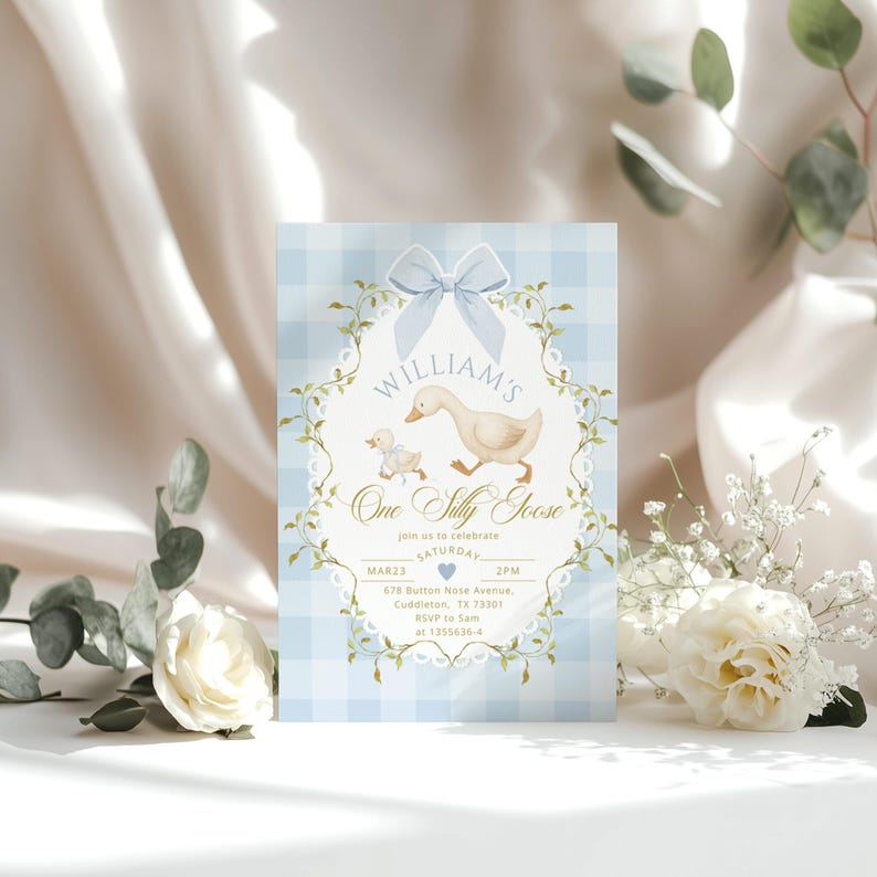 May include: A light blue and white gingham patterned invitation with a watercolor illustration of a goose and gosling. The text reads "William's One Silly Goose" with event details. A light blue bow and floral accents frame the design.