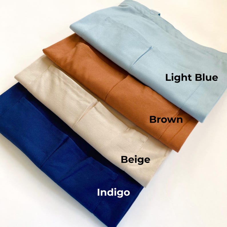 4 set of durable tote bags folded showing 2 front pockets in indigo, beige, brown & sky blue colors.