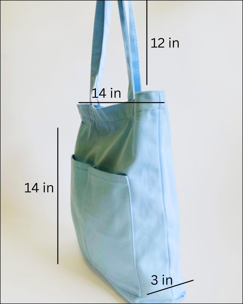 light blue medium shopping tote bag with multiple pockets and zipper showing 12 inches straps, 14 inches width, 14 inches height and 3 inches bottom
