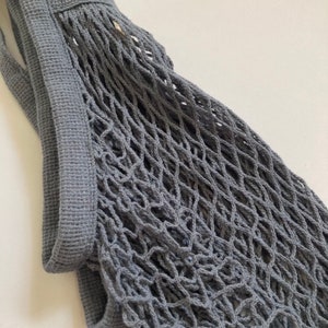 close up image of gray mesh bag showing the side and netting