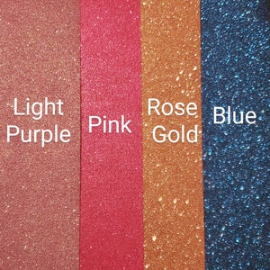 May include: Four samples of glitter in different colors: light purple, pink, rose gold, and blue.