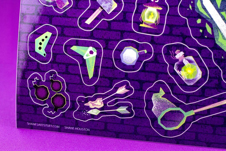 May include: A sticker sheet with fantasy-themed illustrations. The stickers include a hammer, lantern, potion bottle, arrows, and other tools, all outlined in white against a purple brick wall background. The artist's website is visible.