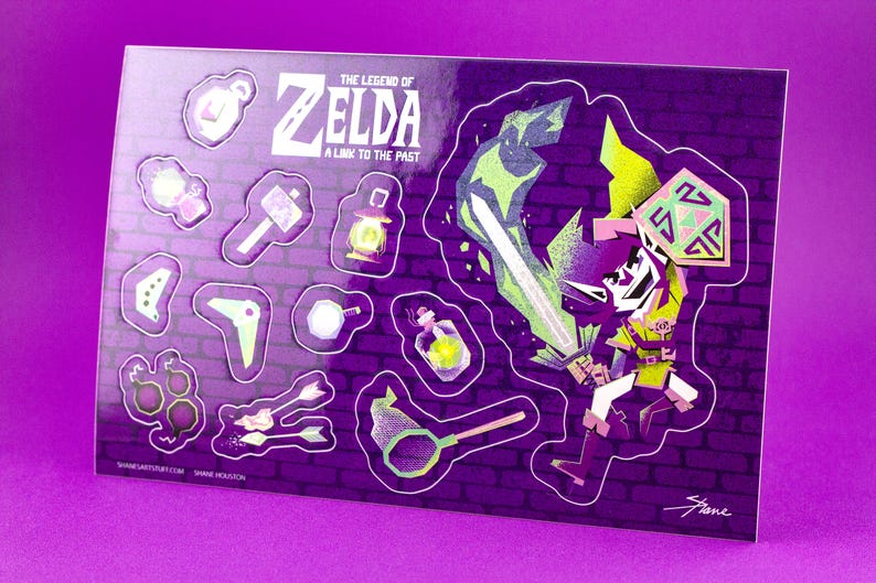 May include: A sticker sheet featuring characters and items from "The Legend of Zelda: A Link to the Past." The stickers include a sword, shield, and game icons, set against a purple brick wall background.