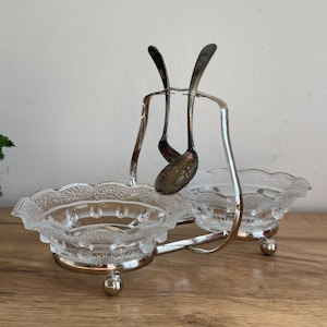 May include: A set of three ceramic mugs with a speckled, matte finish. The mugs are in shades of cream, light gray, and dark gray. Each mug has a simple, minimalist design, perfect for coffee or tea.