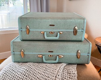 mint green luggage