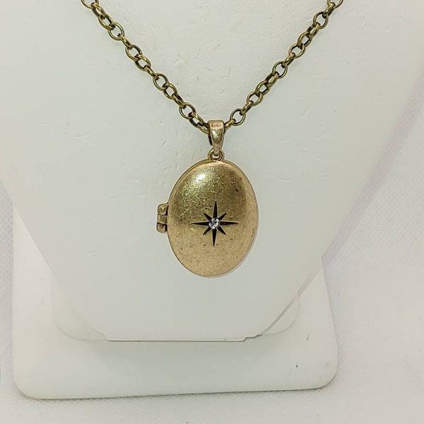 Antique Gold Finish Oval Locket with a Star Engraved on the front and a Crystal in the Middle on a 22" Brass Rolo Chain Necklace