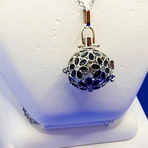 Round Cage/Diffuser Locket  with black  flowers that have a crystal center on a 24&quot; Fine Cable Chain with Lobster Clasp