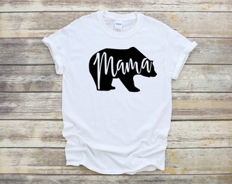 May include: White t-shirt with a black bear silhouette and the word "Mama" inside the bear.