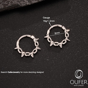 May include: Two silver-colored hoop earrings with a spiked chain design. Each earring is 8mm in diameter and has a gauge of 16g/1.2mm. The text "Search OuferJewelry for more stunning designs!" is displayed.