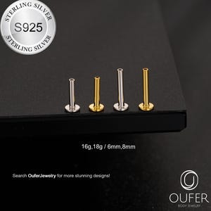 Pode incluir: Uma coleção de brincos de joias corporais prateados e dourados. Os brincos são exibidos em uma superfície escura. A imagem inclui o texto "STERLING SILVER S925" e "16g, 18g / 6mm, 8mm". A marca "OUFER BODY JEWELRY" também é visível.