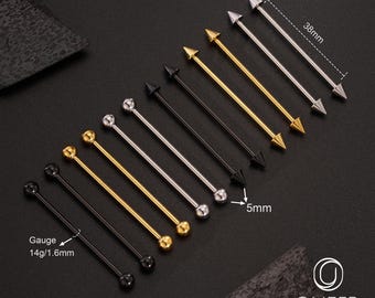 Puede incluir: Una variedad de barras industriales en varios colores, incluyendo negro, dorado y plateado. Las barras tienen diferentes diseños en los extremos, como bolas y conos. El calibre es de 1,6 mm y la longitud es de 38 mm. La imagen también incluye el logotipo de la marca.