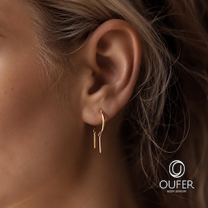 Ett par öronträdare i kirurgiskt stål i 20G, hästskoörhängen, spiraltrådsmycken för piercinglob