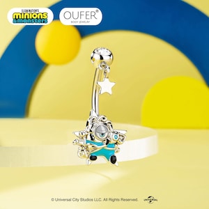 May include: A silver-toned belly button ring featuring a dangling star charm and a character pendant with a single eye, blue clothing, and black accents. The top ball of the barbell is set with a clear, round gemstone. The piece is branded OUFER.