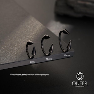 May include: Three black circular body jewelry rings with pointed spike ends, labeled with sizes 8mm, 10mm, and 12mm. The text "Search OuferJewelry for more stunning designs!" and the "OUFER BODY JEWELRY" logo are visible at the bottom of the image.