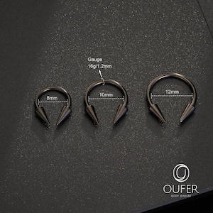 May include: Three black circular barbells with spike ends, featuring a 16g/1.2mm gauge. The rings have internal diameters of 8mm, 10mm, and 12mm respectively. The OUFER BODY JEWELRY logo is visible in the bottom right corner of the image.