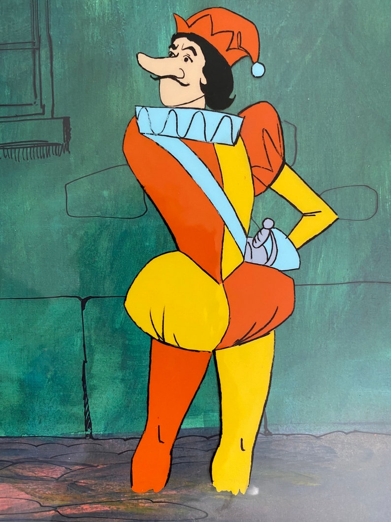 May include: Cartoon illustration of a man in a colorful jester costume. The character wears a red and orange hat, a ruffled collar, and a yellow and orange outfit. He has a long nose and a stern expression, with a sword at his side.